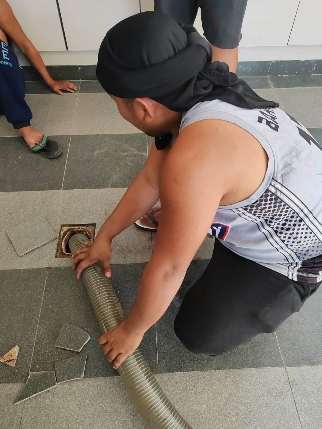 Manual septic tank cleaning by Malabanan team